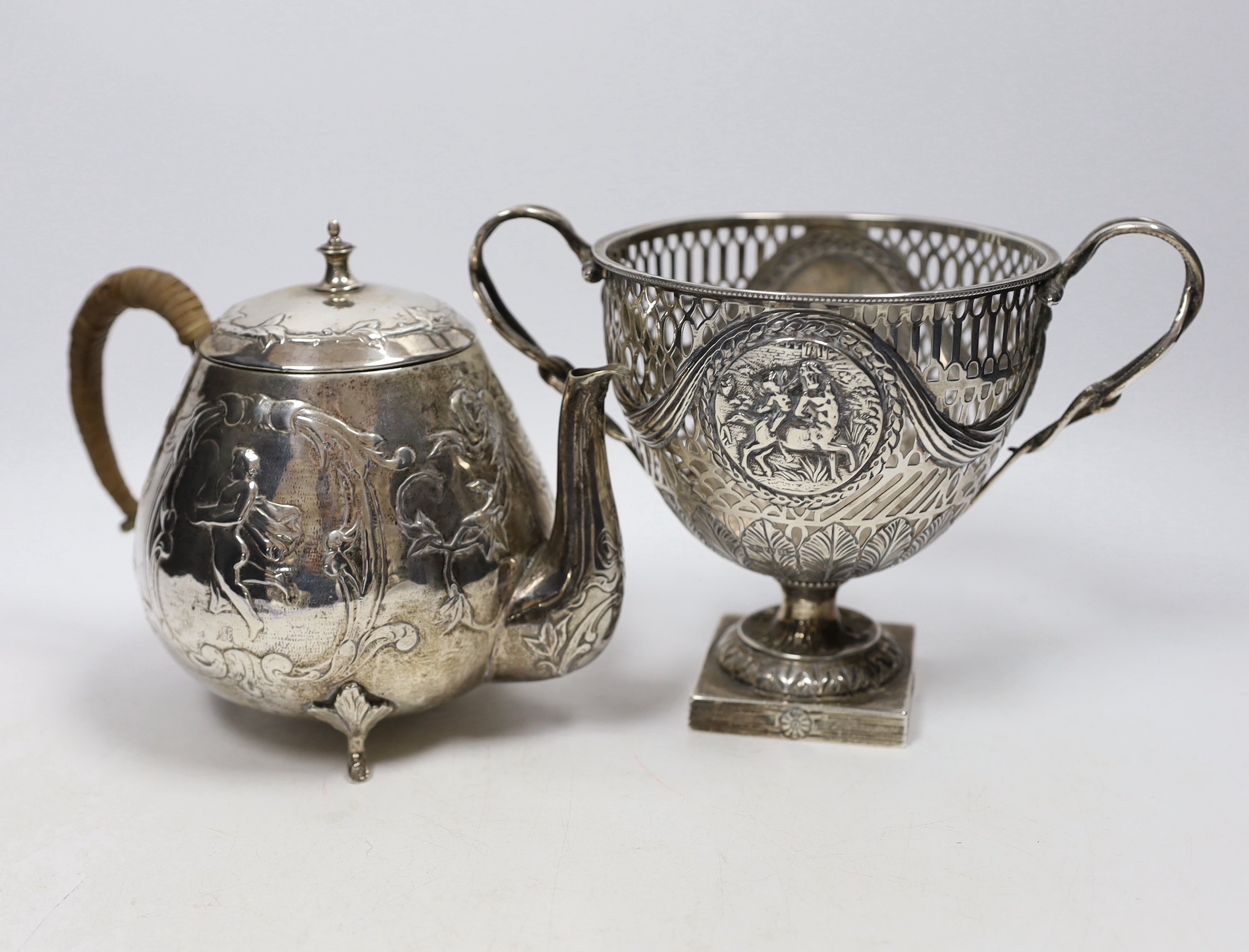 A late Victorian pierced silver neo-classical design sugar bowl, Chester 1900, 261 grams, and a 19th century Dutch silver teapot, decorated with classical figures and scrolls, gross 392 grams